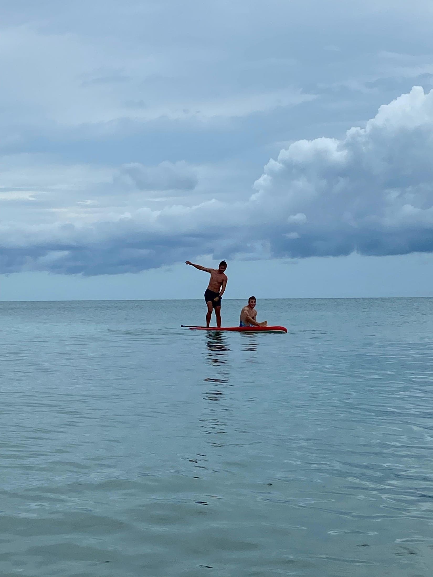 Paddleboarding on a glassy sea