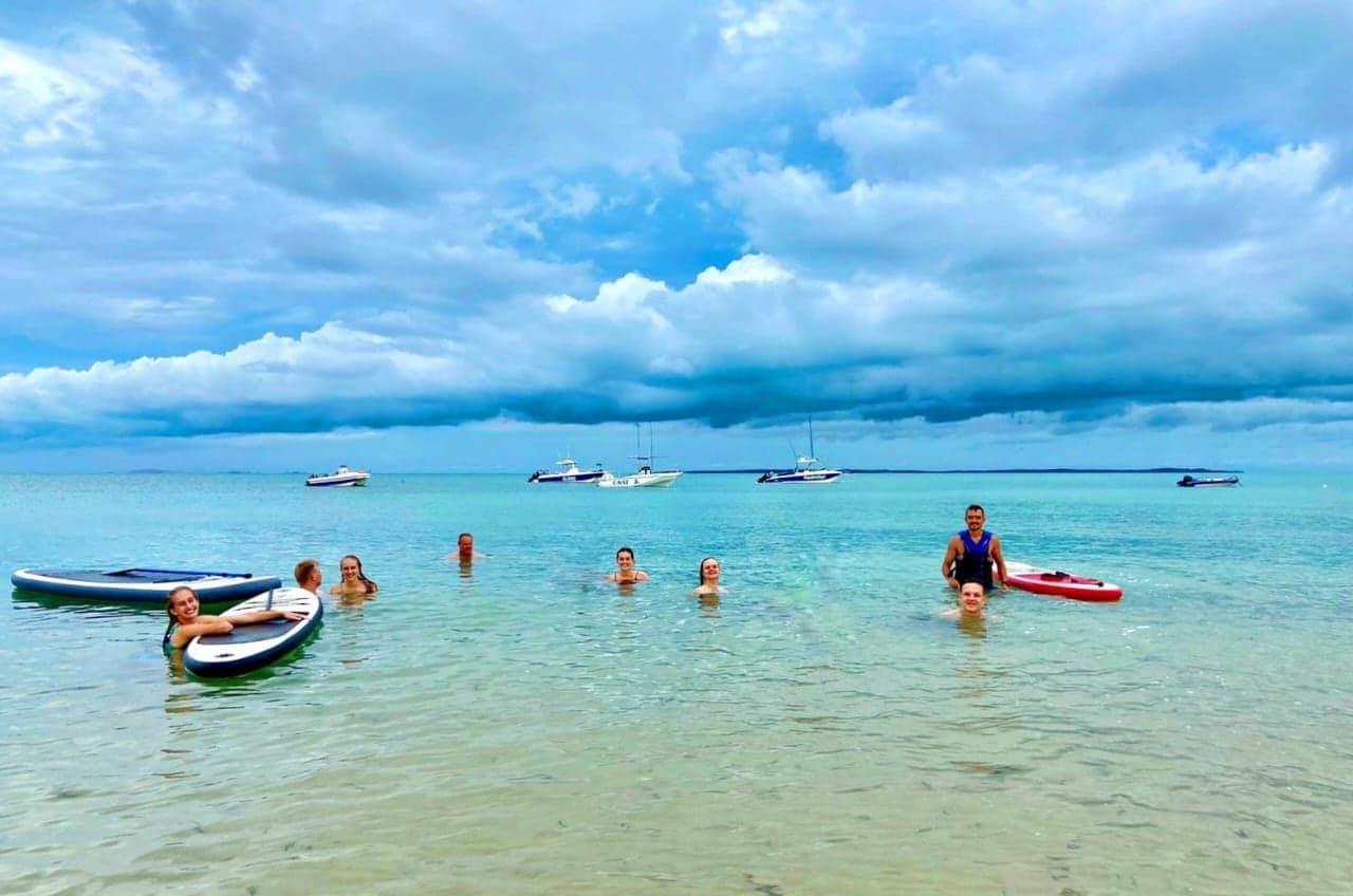 Swimming and paddleboarding in the turquoise shallows