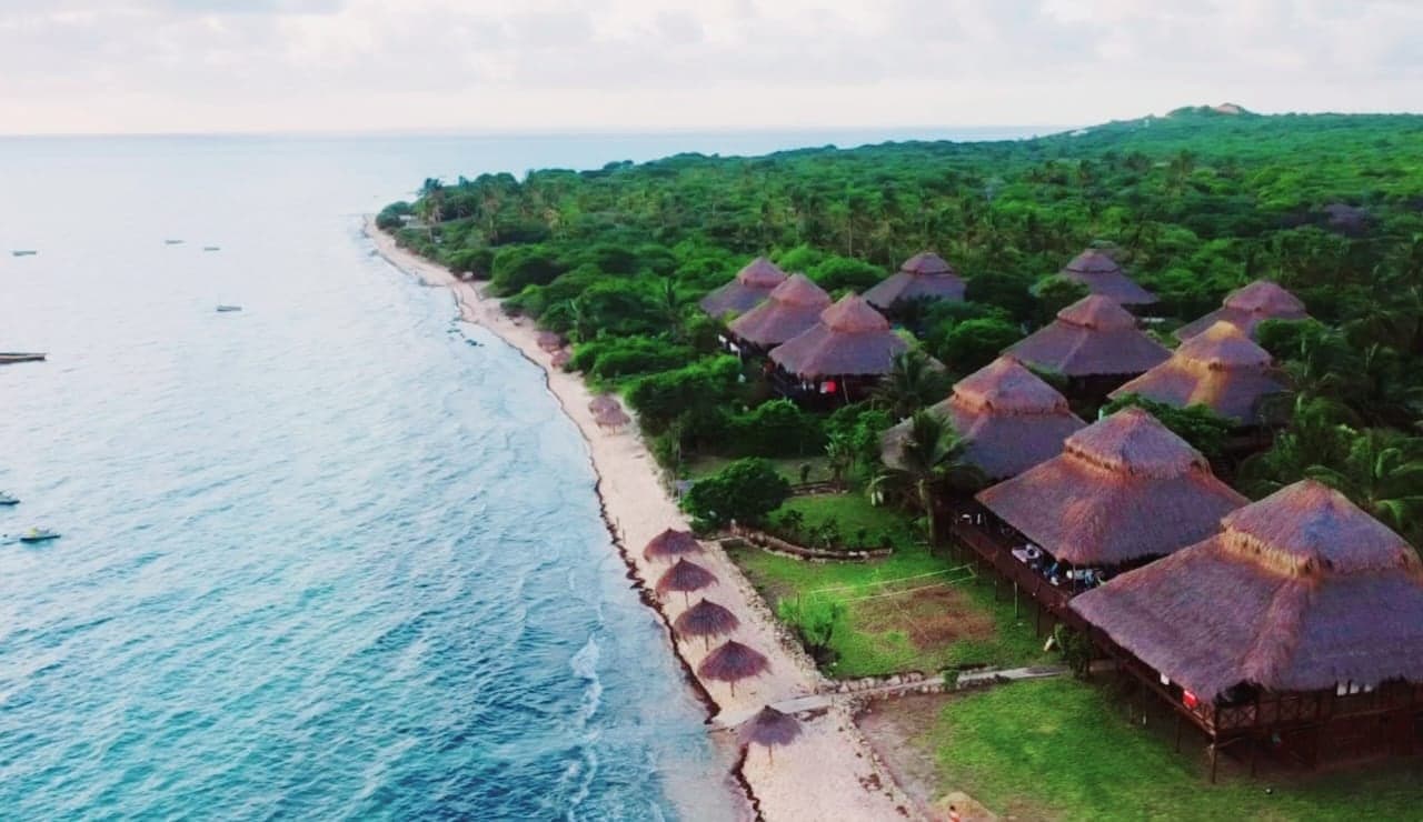 The casas along the shore from above at golden hour