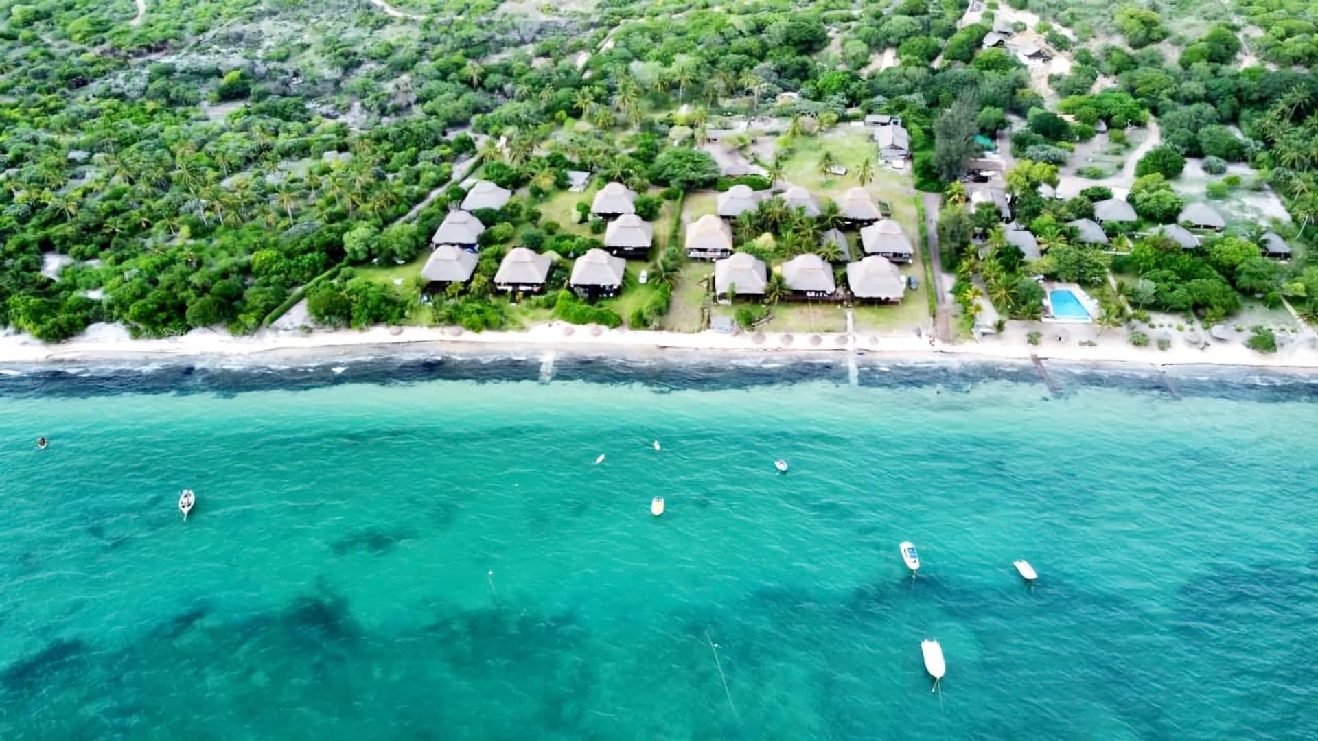Aerial view of Blue Paradise Beach Lodge and the turquoise sea off Vilanculos