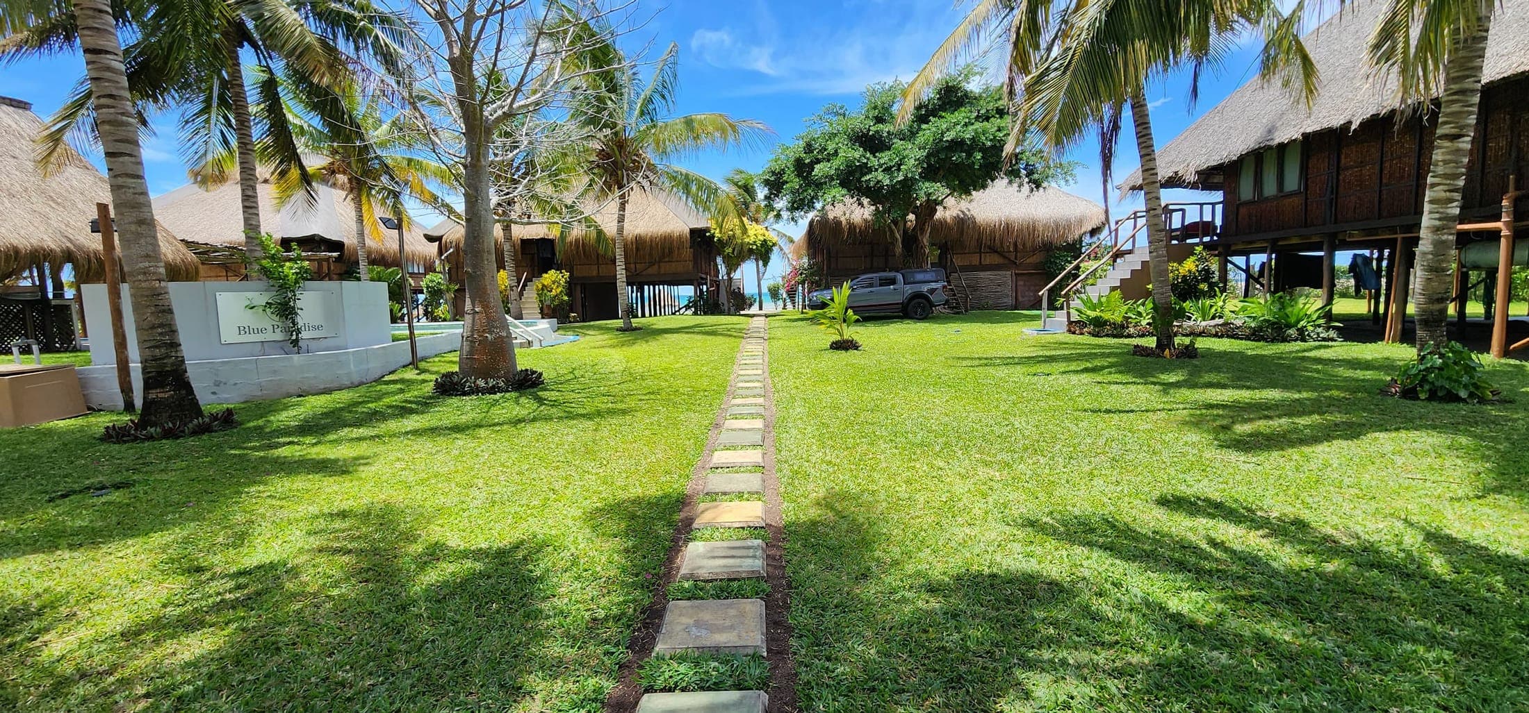 Garden path between the casas with the ocean beyond